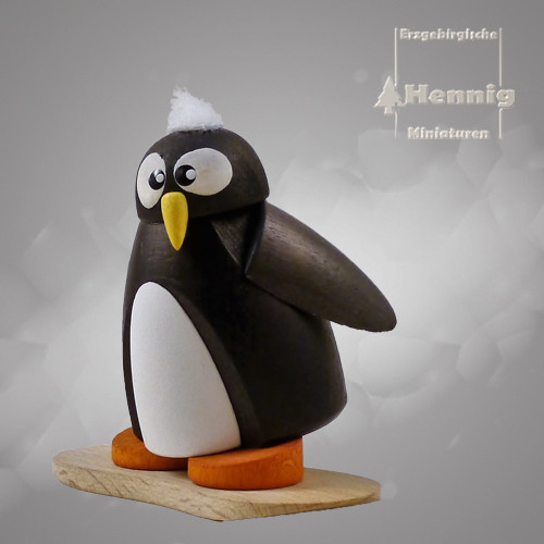 Hennig Figuren - Pinguin auf Snowboard